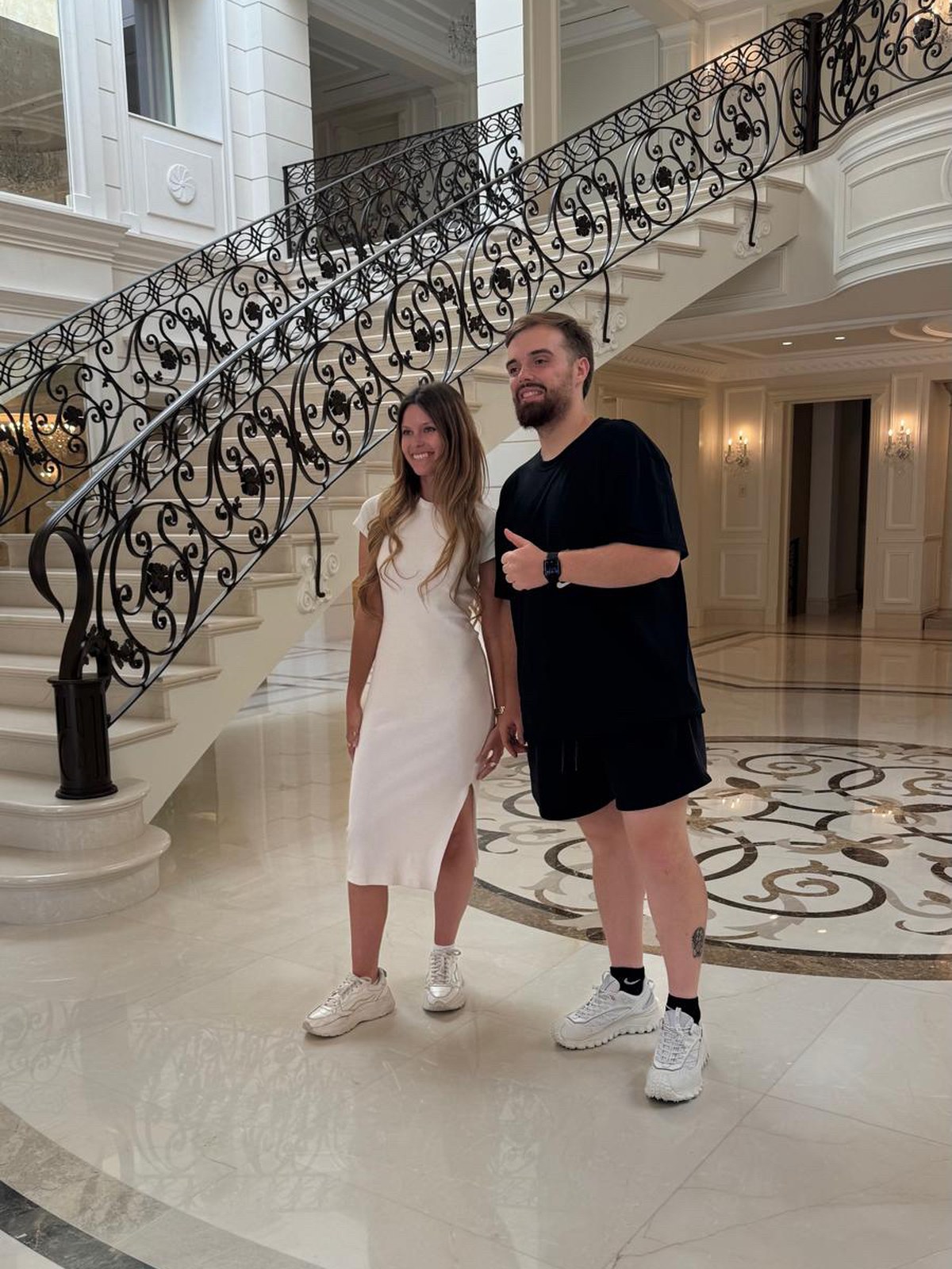 Behind the scenes on the villa's grand marble staircase during the three-day campaign shoot